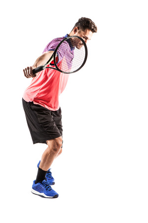 Young man is playing tennis isolated on whiteの写真素材