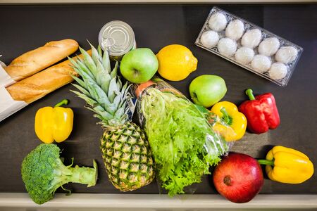 A lot of food on the counter in supermarket. Top viewの写真素材