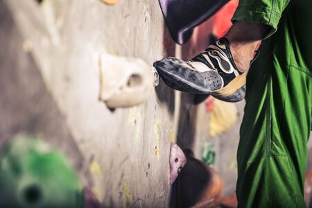 Close-up image of male foot on climbing wallの写真素材