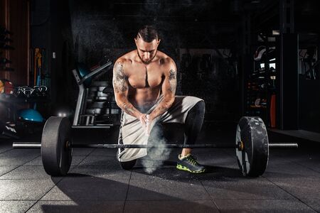Young athlete getting ready for crossfit trainingの写真素材