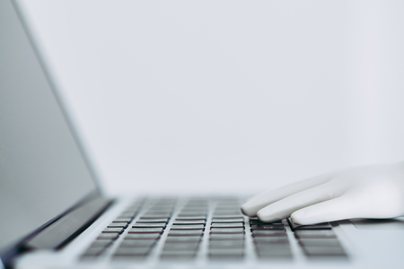 Artificial intelligence hand type on keyboardの写真素材