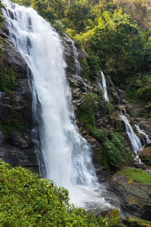 Waterfall flowing from the rock. Mountain river waterfall landscape. Waterfall backgroundの写真素材