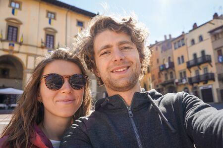 Young couple doing selfie. Travel. Lifestyle concept. Couple of young attractive touristsの写真素材