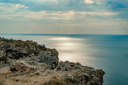 Russia. Republic of Crimea. Cape Fiolent in summer. Coast of the Black Sea. Sunset by the sea.