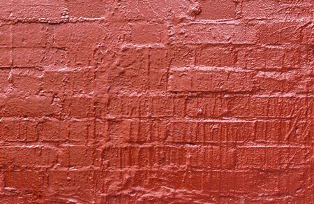Brick wall painted red.の写真素材