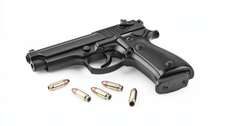 A black handgun displayed alongside several ammunition rounds on a clean white background. Ideal for themes of security, law enforcement, and self-defense.の素材