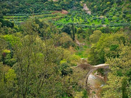 Traditional arch stone bridge above Neda river in Peloponnese, Greece. View from above.の写真素材