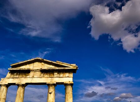 Gate of Archegetis Athena in ancient site of Roman Forum in Athens, Greece, against deep blue sky...