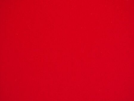 Close up photo of vivid red textured empty cardboard , can  be used as background.の写真素材