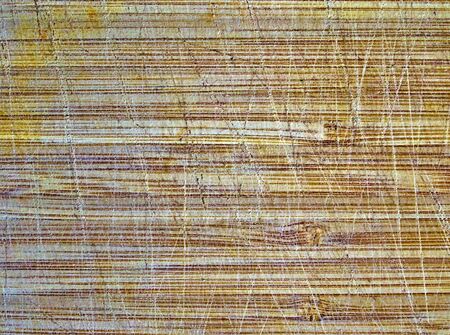 Close up detail on cutting board with knife cut marks. Textured background.の写真素材