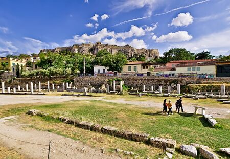 Tourists visit the ancient site of Roman Forum, under Acropolis, in Monastiraki area in Athens Greece.のeditorial素材