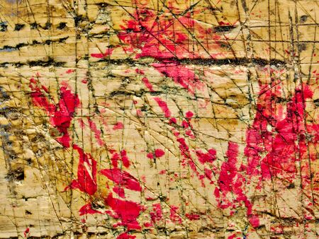 Wooden workbench aged surface with red paint stains, close up, abstract background,の写真素材