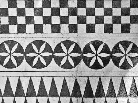 Decorative black and white geometrical shapes on exterior wall at Pyrgi village, Chios island,...