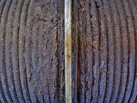 Rolled up greasy wire rope  close up.の写真素材