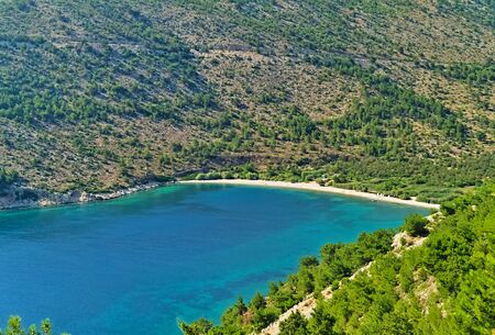 Beautiful isolated beach of Elinda with turquoise water, view from above, Chios island, Greece.の写真素材