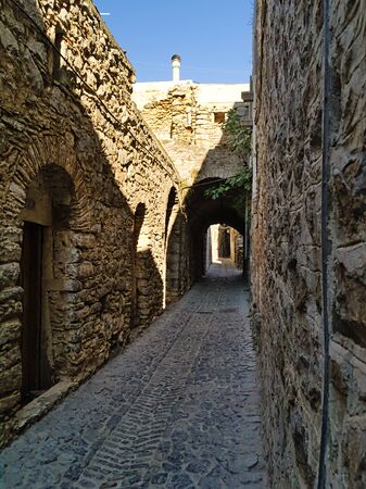 Medieval narrow alley at the village of Mesta in Chios island , Greece.の写真素材