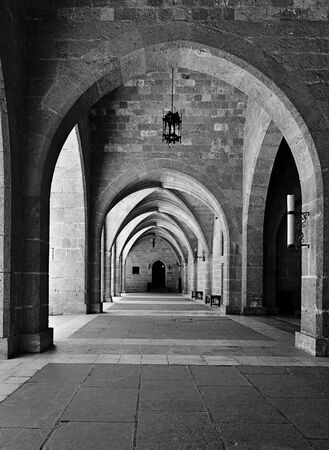 Arched passage at the palace of Grand Master of the knights of Rhodes, also known as Kastello, Greece, black and white image.の写真素材