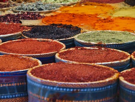 Multiple spices in colorful containers in Istanbul, Turkey market.の写真素材