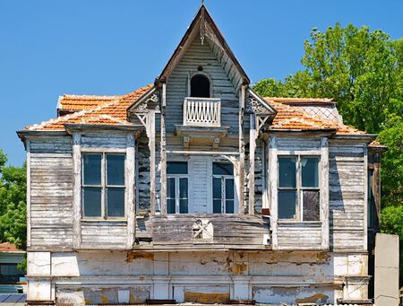 Abandoned weathered wooden house at the coast of Bosporus strait, Istanbul, Turkey.の写真素材