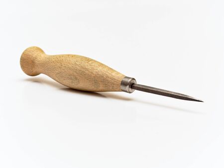Stitching Awl. Leather working tool isolated on white background.の写真素材