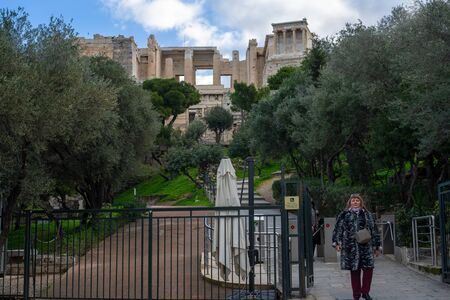 Athens / Greece  Acropolis archeological site entrance. Woman, getting out. Sightseeing ancient place access gate.のeditorial素材