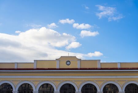 Old classy architecture building facade with arched doors against blue sky. Athens, Monastiraki station.の写真素材