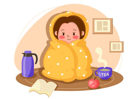 Young cute girl spends time at home wrapped in a blanket on a cold winter day. Cozy time at home in a blanket with tea, a book and an apple. Staying at home vector modern cartoon illustrationのイラスト素材