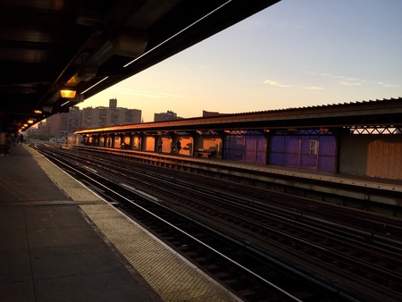 Subway platform at Flushing ave., Brooklyn, New York, with sunset light in perspectiveの写真素材