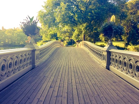 Bow bridge walkway in vintage style, Central Park, Manhattan, New Yorkの写真素材