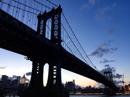 Silhouette of Manhattan bridge before sunset in , New Yorkの写真素材