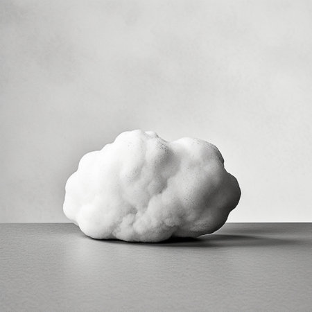 White fluffy clouds on a gray background. Minimalistic style.の素材