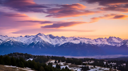 Beautiful sunset in the mountains. Landscape with snowy mountains.の素材
