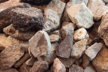 many shallow river stones as a backgroundの写真素材