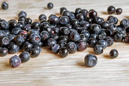 ripe whortleberry on a light boardの写真素材