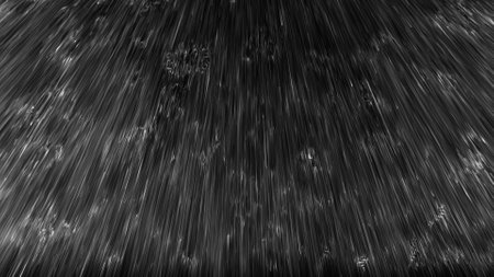 Image of rain falling on a black backgroundの写真素材