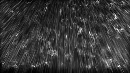 Image of rain falling on a black backgroundの写真素材