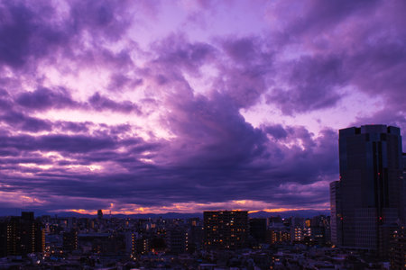 Images of sky, clouds, city and buildings, from daytime to sunsetの写真素材