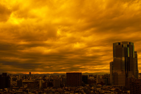 Images of sky, clouds, city and buildings, from daytime to sunsetの写真素材