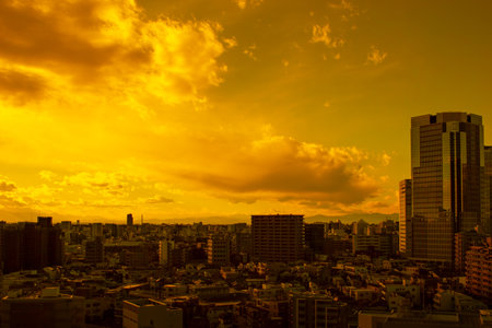 Images of sky, clouds, city and buildings, from daytime to sunsetの写真素材