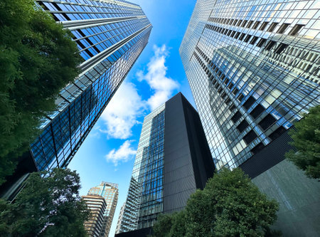 High-rise apartment building in the city and blue sky, daytime, looking upの写真素材