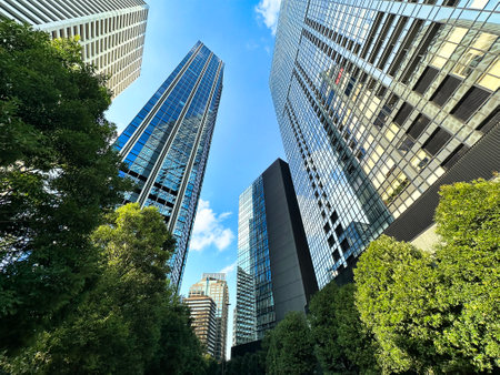 High-rise apartment building in the city and blue sky, daytime, looking upの写真素材