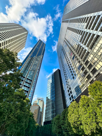 High-rise apartment building in the city, blue sky and white clouds, daytime, Shinjuku, Tokyo, Japanの写真素材