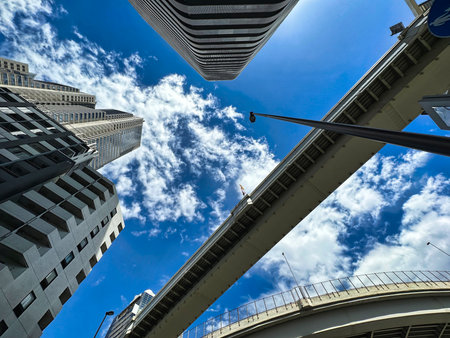Shinjuku skyscrapers and highway, blue sky and white clouds, daytimeの写真素材