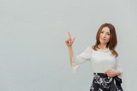 Lady pointing somethingの写真素材