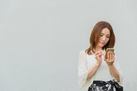 Lady looking at smartphoneの写真素材