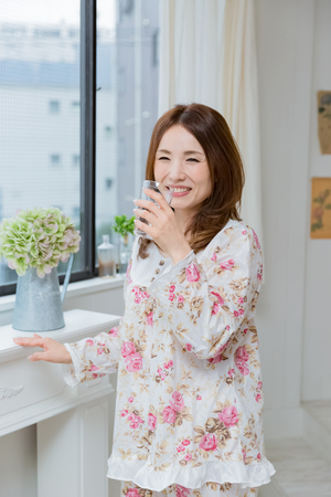 Lady drinking waterの写真素材