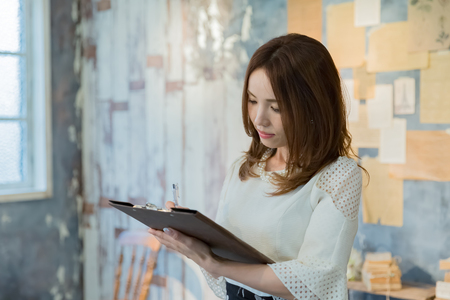 Lady holding clipboardの写真素材