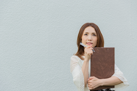 Lady holding clipboardの写真素材