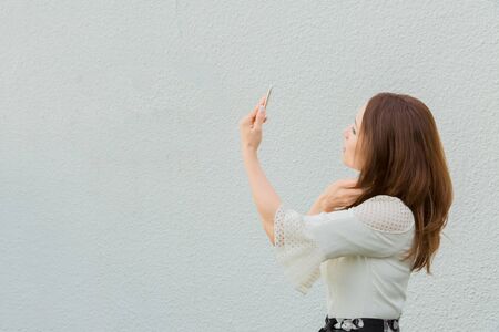 Lady taking pictures by her selfの写真素材