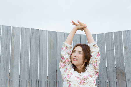 Lady in nightwear stretching outsideの写真素材